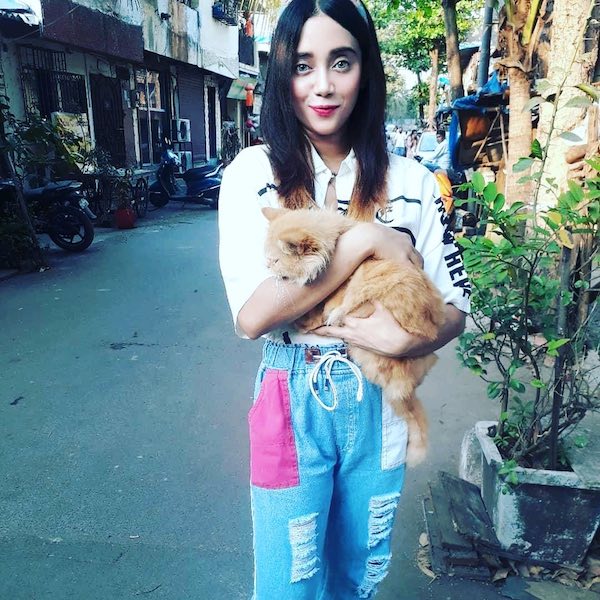 Aritaa Misti Paul holding a cat