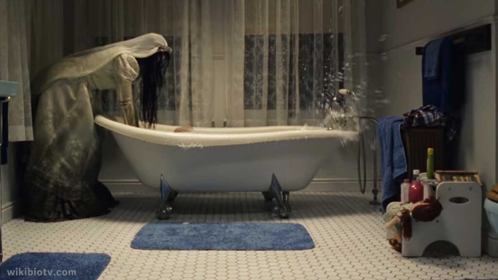 La Llorona tries to drown Sam in bathtub